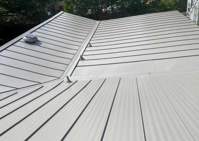 Solar attic fan installed on a metal roof for Roof Ventilation in Sweet Home